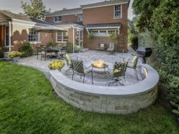 PetrovicImagery_Apex_Elmwood-3-scaled Paver patio with curved seat wall and fire pit — Apex Landscaping