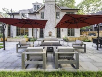 PetrovicImagery_Apex_Asbury-10 Paver patio with fire pit lounge seating and an outdoor kitchen — Apex Landscaping
