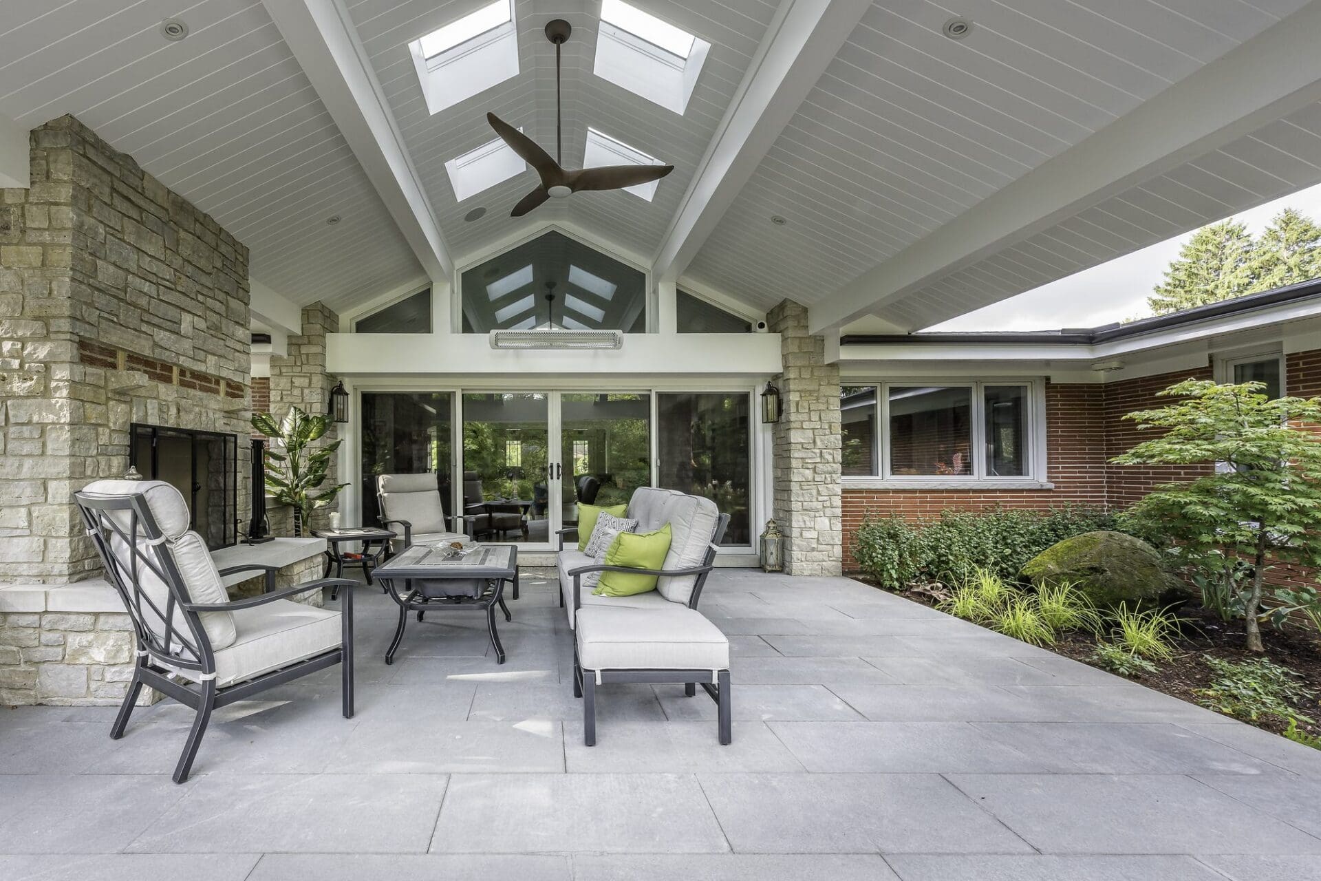Vaulted covered outdoor porch with ceiling fan — Apex Landscaping design-build