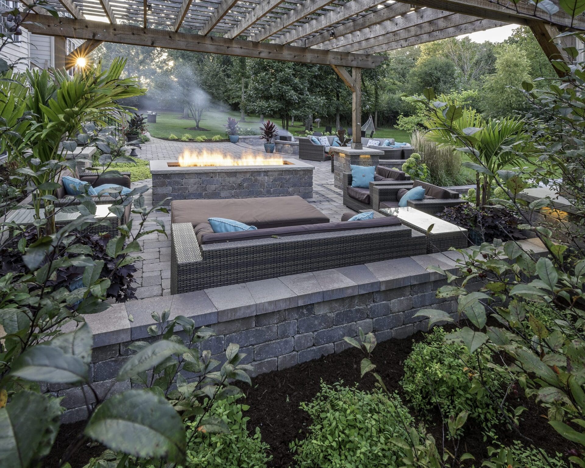 Pool and spa with landscape lighting at dusk — Apex Landscaping design-build