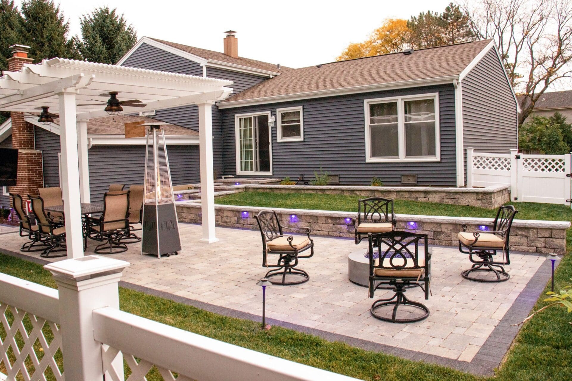 Pergola over a paver patio dining area — Apex Landscaping