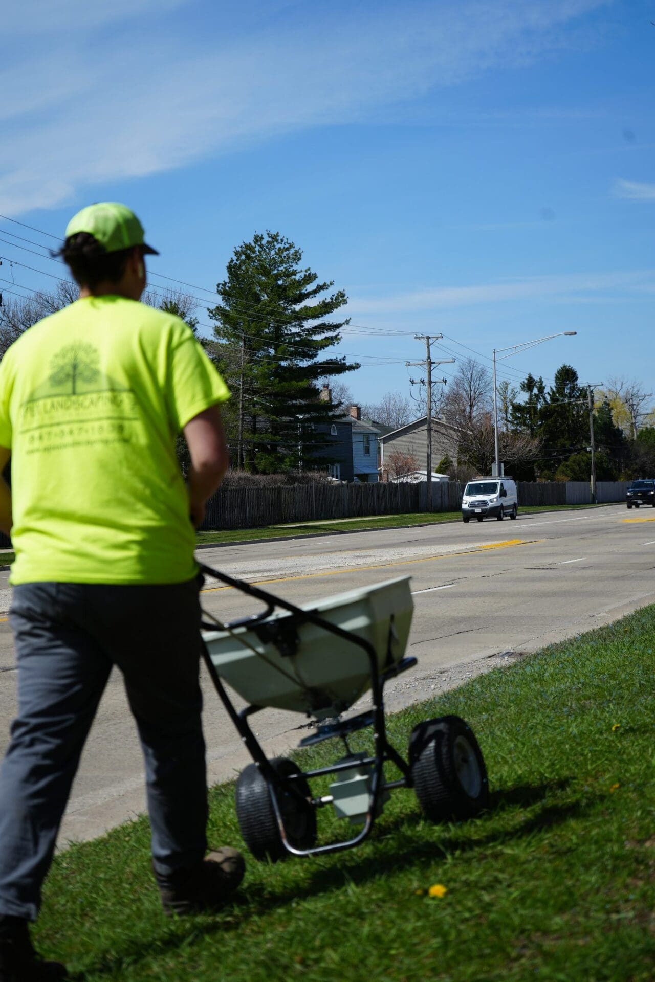 Applying granular fertilizer with a broadcast spreader — Apex Landscaping