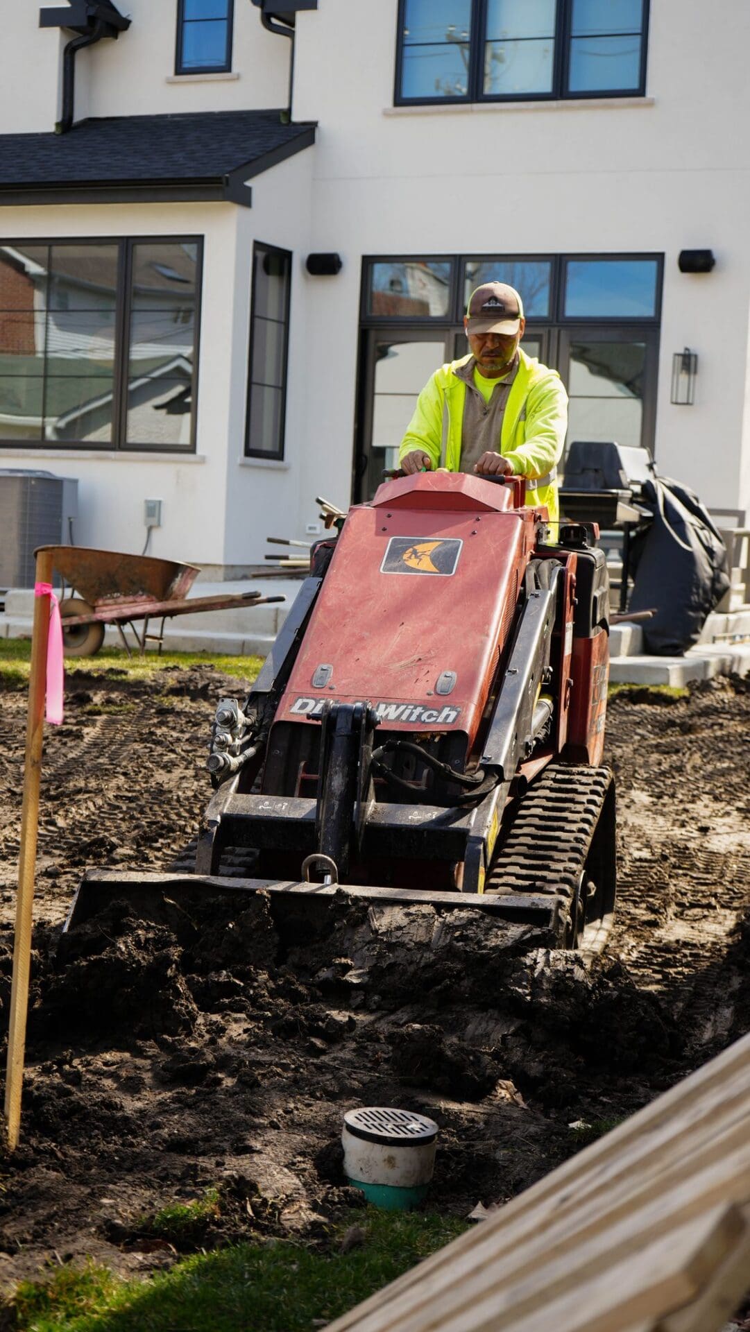 Grading a yard with a mini track loader for a new lawn — Apex Landscaping