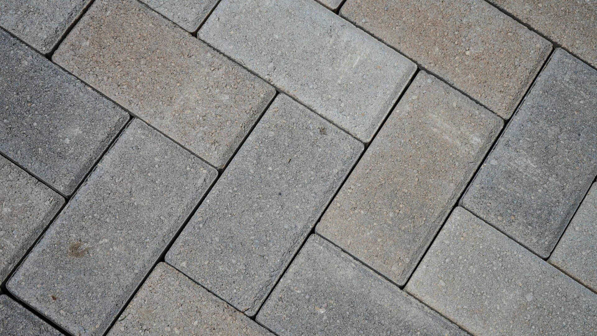 Herringbone paver pattern detail — Apex Landscaping